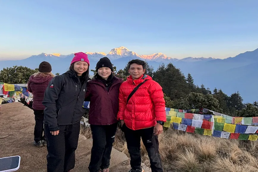 Trekkers enjoying views of Dhaulagiri Mountain from Poon Hill during the 5-day Ghorepani Poon Hill Trek in Nepal.